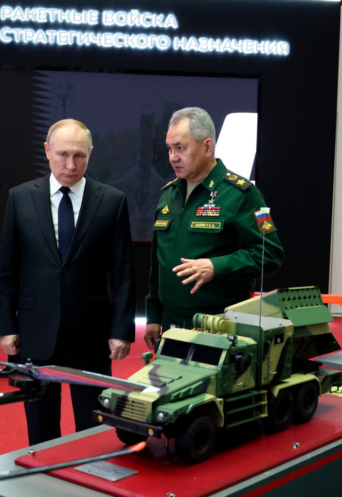 Defense Minister Sergei Shoigu, right, unveiled a plan to boost Russia's forces by 30%.