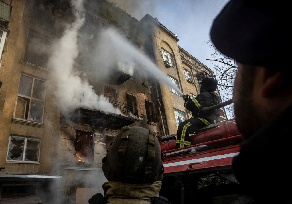 Firefighters work to put out a fire at a residential building hit by a Russian military strike in Bakhmut, Donetsk region, which has seen some of the fiercest fighting of the war. 