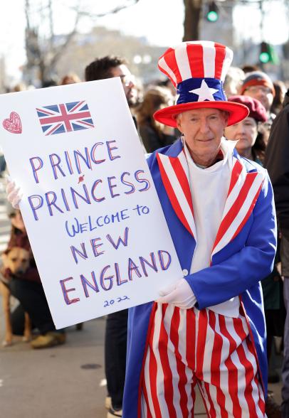 A man with a sign welcoming William and Kate to New England on the second day of their visit.
