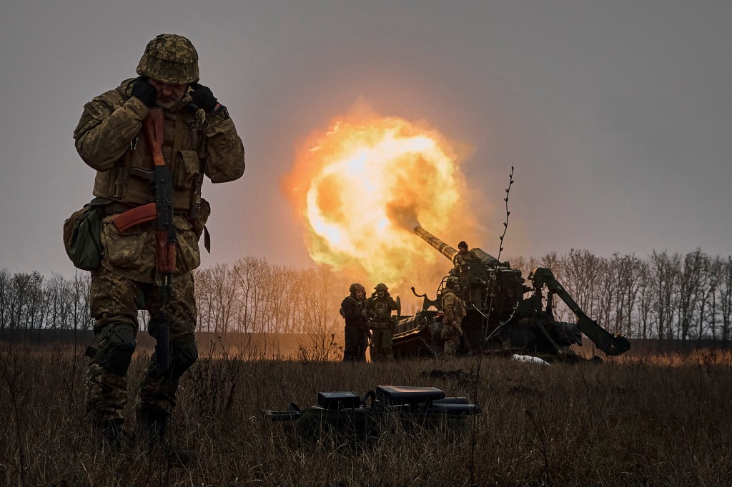 Ukrainian soldiers fire a Pion artillery system at Russian positions near Bakhmut.