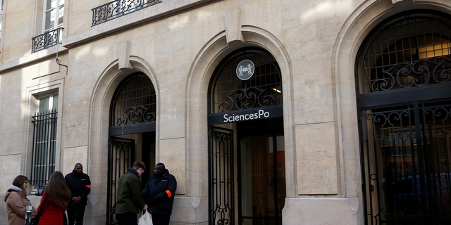 Students are seen outside Paris' Sciences Po university in Paris, France, March 15, 2016. REUTERS/Philippe Wojazer