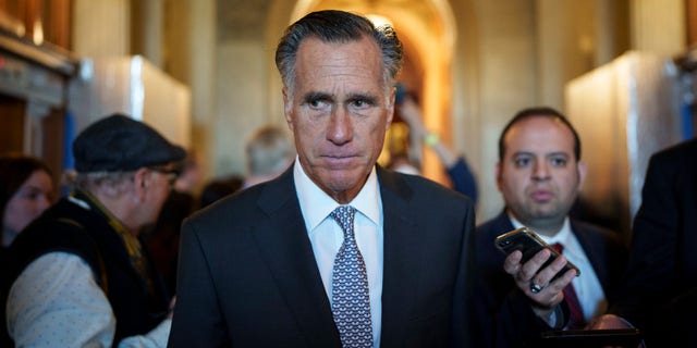 WASHINGTON, DC - NOVEMBER 16: Sen. Mitt Romney (R-UT) leaves the Senate floor after voting yes on a procedural vote on federal legislation protecting same-sex marriages, at the U.S. Capitol on November 16, 2022 in Washington, DC.  (Photo by Drew Angerer/Getty Images)