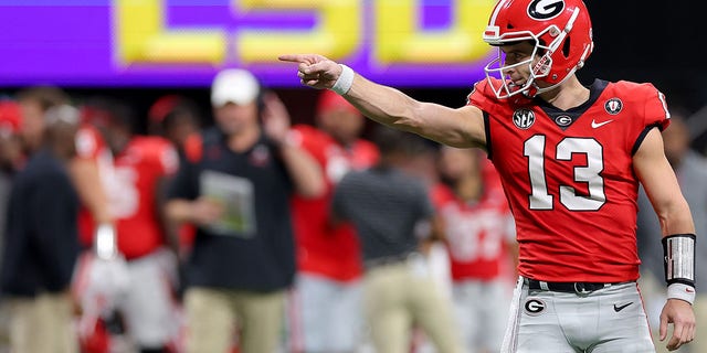 Stetson Bennett of the Georgia Bulldogs celebrates after throwing a touchdown pass against the LSU Tigers during the second quarter in the SEC championship game at Mercedes-Benz Stadium Dec. 3, 2022, in Atlanta.