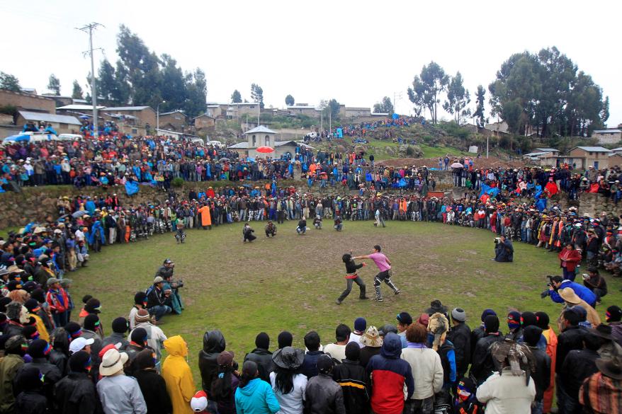 Andean men participate in a one-on-one fight during the "Takanakuy".