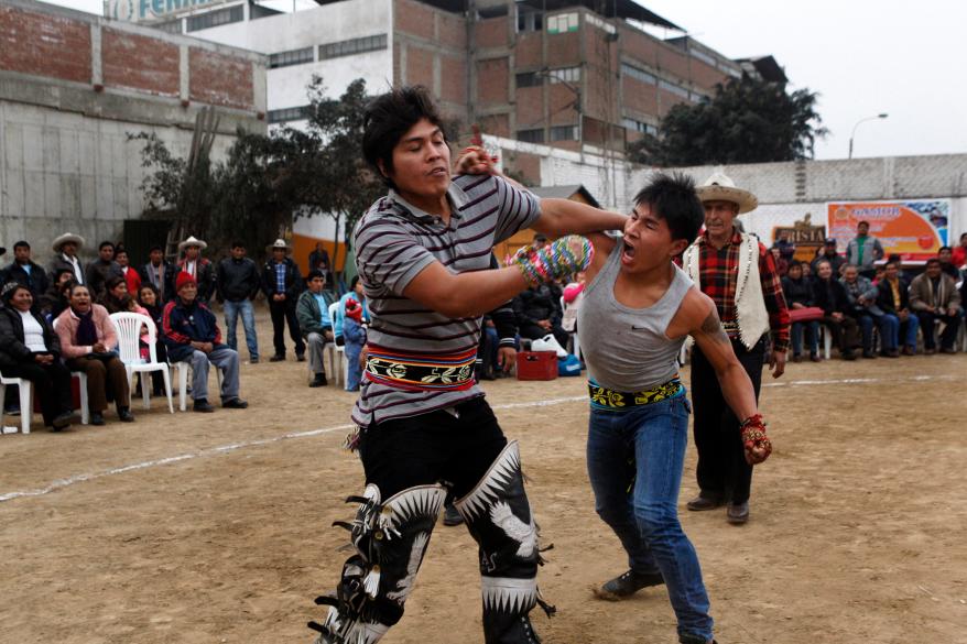 Andean men participate in a one-on-one fight during the "Takanakuy".