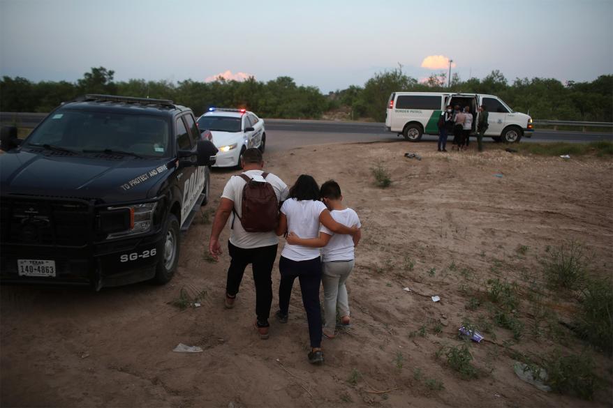 A migrant family that crossed the Rio Grande into Mexico is taken away by Border Patrol.