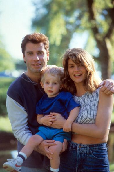 John Travolta and Kirstie Alley holding a child in a scene from the film 'Look Who's Talking' in 1989.