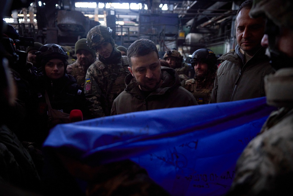 On his visit to Bakhmut, Zelensky was handed a Ukrainian flag signed by troops, which he hinted he will be passing on to US leaders. 