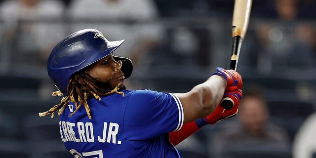 The Toronto Blue Jays' Vladimir Guerrero Jr. hits a home run against the New York Yankees in the ninth inning of a game Sept. 9, 2021, in New York.