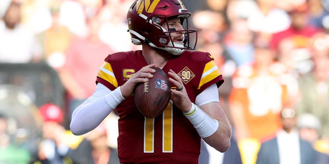 Carson Wentz #11 of the Washington Commanders throws a pass against the Cleveland Browns during the first half of the game at FedExField on January 01, 2023 in Landover, Maryland. 