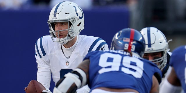 Nick Foles of the Indianapolis Colts takes the snap against the New York Giants at MetLife Stadium on Jan. 1, 2023, in East Rutherford, New Jersey.