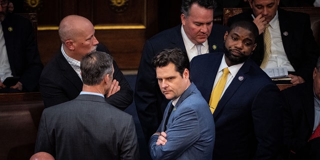 WASHINGTON, DC - JANUARY 04: Rep. Chip Roy (R-TX), Rep. Scott Perry (R-PA), Rep. Matt Gaetz (R-FL) and Rep. Byron Donalds (R-FL) confer with each other on the floor of the House Chamber of the U.S. Capitol Building on Wednesday, Jan. 4, 2023 in Washington, DC. 