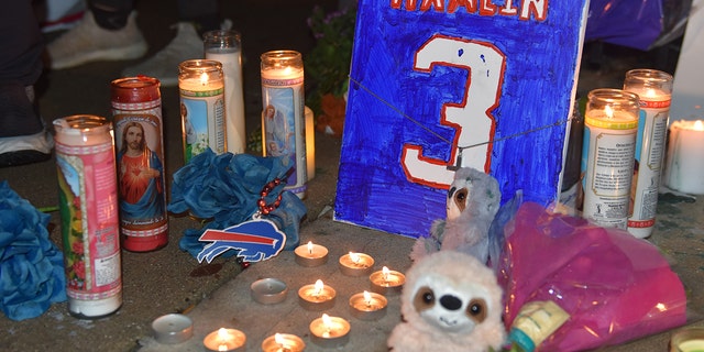 Fans gather to support Buffalo Bills safety Damar Hamlin outside the UC Medical Center in Cincinnati on Tuesday. Hamlin collapsed on the field during an NFL game on Monday.