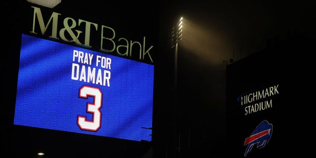 Buffalo Bills fans attend a candlelight prayer vigil for player Damar Hamlin at Highmark Stadium Jan. 3, 2023, in Orchard Park, New York. 