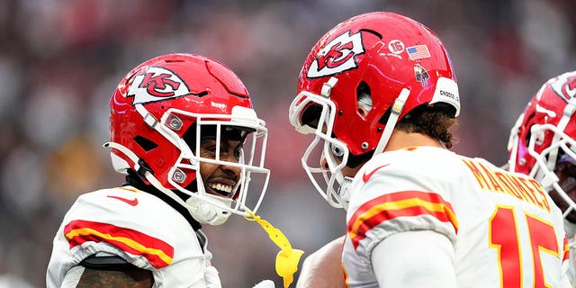 Jerick McKinnon, left, and Patrick Mahomes (15) of the Kansas City Chiefs celebrate after a touchdown against the Las Vegas Raiders during the first quarter at Allegiant Stadium Jan. 7, 2023, in Las Vegas. 