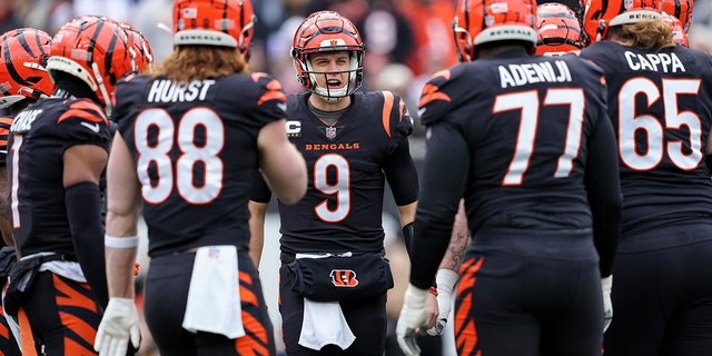 Joe Burrow, #9 of the Cincinnati Bengals, huddles with his team in the first quarter against the Baltimore Ravens at Paycor Stadium on Jan. 8, 2023 in Cincinnati.