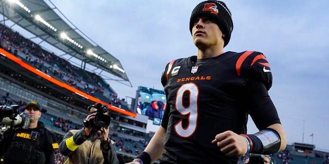 Bengals quarterback Joe Burrow runs off the field after the win over the Baltimore Ravens in Cincinnati, Sunday, Jan. 8, 2023.