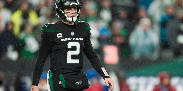 Zach Wilson of the New York Jets walks to the sideline against the Jacksonville Jaguars at MetLife Stadium on Dec. 22, 2022, in East Rutherford, New Jersey.