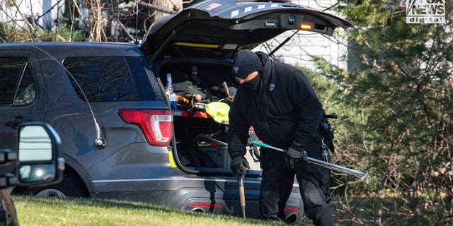 Police/investigators  bringing equipment into Walshe home at 516 Chief Justice Cushing Highway, Cohasset, MA, after Brian Walshe and children departed.