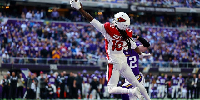 DeAndre Hopkins of the Arizona Cardinals catches the ball for a touchdown at U.S. Bank Stadium on Oct. 30, 2022, in Minneapolis, Minnesota.