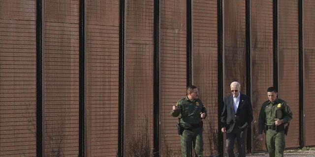 President Biden walks with U.S. Border Patrol agents along a stretch of the U.S.-Mexico border in El Paso, Texas, Sunday, Jan. 8, 2023. 