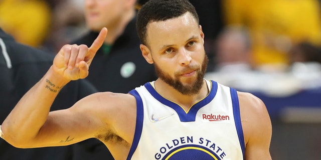 Golden State Warriors guard Stephen Curry celebrates during the second half of Game 5 of the NBA Finals against the Boston Celtics in San Francisco June 13, 2022. 