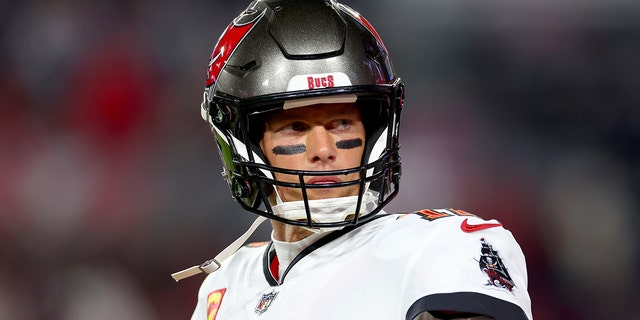 Tom Brady #12 of the Tampa Bay Buccaneers warms up prior to a game against the Dallas Cowboys in the NFC Wild Card playoff game at Raymond James Stadium on January 16, 2023 in Tampa, Florida.