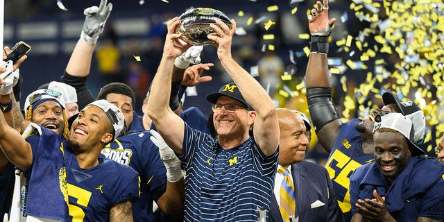 Michigan Wolverines head coach Jim Harbaugh celebrates after the Big 10 Championship game between the Michigan Wolverines and Purdue Boilermakers on December 3, 2022, at Lucas Oil Stadium in Indianapolis, IN. 