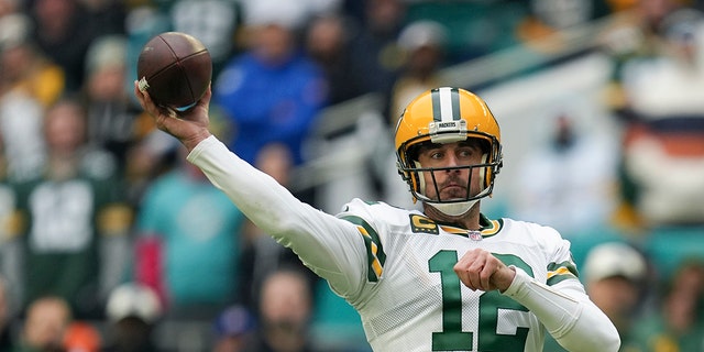 Green Bay Packers quarterback Aaron Rodgers (12) passes during the first half of a game against the Miami Dolphins, Sunday, Dec. 25, 2022, in Miami Gardens, Fla.