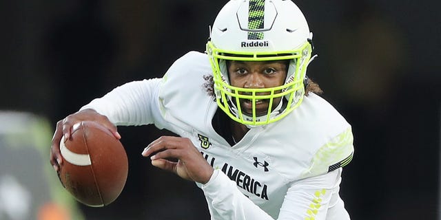 Quarterback Jaden Rashada runs with the ball during the Under Armour Next All-America Game in Orlando on Jan. 3, 2023.