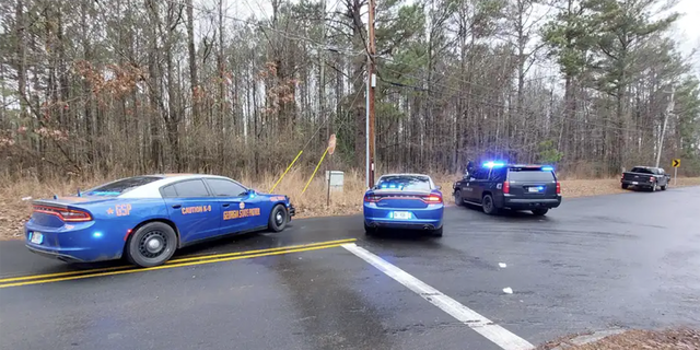 Police at the scene where a Georgia State Trooper was shot on Wednesday, Jan. 18, 2023.