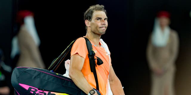 Rafael Nadal acknowledges the crowd after losing to Mackenzie McDonald during the Australian Open on Jan. 18, 2023, in Melbourne.