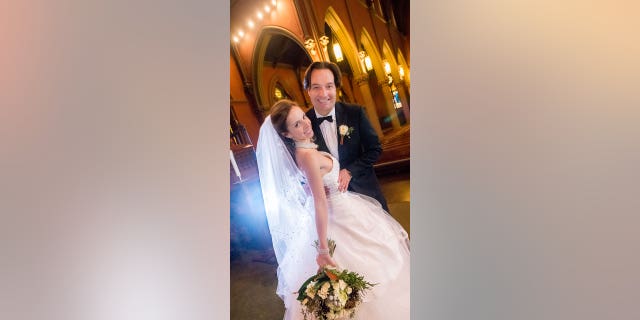 Brian and Ana Walshe on their wedding day in Emmanuel Episcopal church on Newbury St., Boston, Massachusetts on Monday, Dec. 21, 2015.