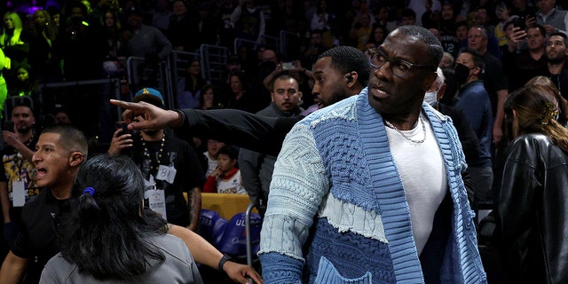 LOS ANGELES, CALIFORNIA - JANUARY 20: Shannon Sharpe reacts after he is restrained by security from Ja Morant, #12 of the Memphis Grizzlies, after a verbal altercation after the first half against the Los Angeles Lakers at Crypto.com Arena on January 20, 2023, in Los Angeles, California. 