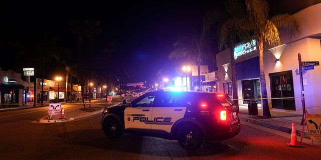 A police vehicle is seen near the scene where a shooting took place in Monterey Park, California, Sunday, Jan. 22, 2023. Dozens of police officers responded to reports of a shooting that occurred after a large Lunar New Year celebration had ended in a community east of Los Angeles late Saturday.