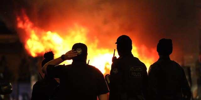 Burning cop cars in Atlanta, Georgia on Saturday, Jan. 21, 2023.