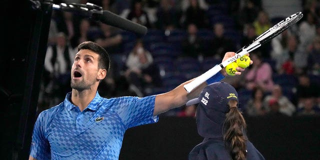 Novak Djokovic of Serbia argues with the chair umpire during his second round match against Enzo Couacaud of France at the Australian Open tennis championship in Melbourne, Australia, Thursday, Jan. 19, 2023. 