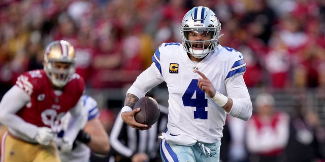 Dallas Cowboys quarterback Dak Prescott carries the ball during the NFC divisional round playoff game against the San Francisco 49ers at Levi's Stadium in Santa Clara, California, Jan. 22, 2023.