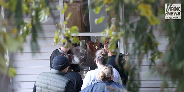 State police forensics officers look for clues in Moscow, Idaho, Nov. 21, 2022. Four University of Idaho students were killed Nov. 13 in the house.