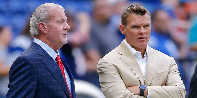 Indianapolis Colts owner Jim Irsay, left, and general manager Chris Ballard watch pregame warmups before a preseason game against the Chicago Bears at Lucas Oil Stadium on Aug. 24, 2019 in Indianapolis.