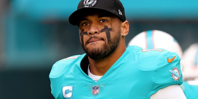 Tua Tagovailoa #1 of the Miami Dolphins takes the field prior to a game against the Green Bay Packers at Hard Rock Stadium on December 25, 2022, in Miami Gardens, Florida. 