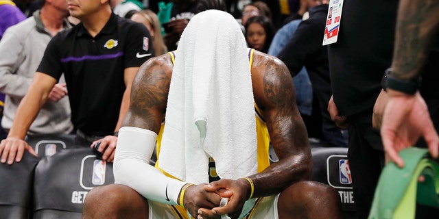 Los Angeles Lakers' LeBron James sits on the bench during overtime against the Celtics, Saturday, Jan. 28, 2023, in Boston.