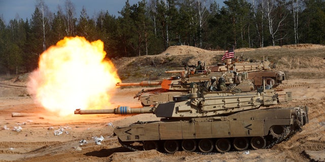 FILE PHOTO: U.S. Army M1A1 Abrams tank fires during NATO enhanced Forward Presence battle group military exercise Crystal Arrow 2021 in Adazi, Latvia March 26, 2021.