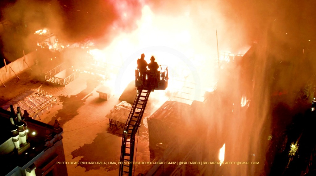 Firefighters work on a building fire in Lima, Peru on Jan. 19, 2023.