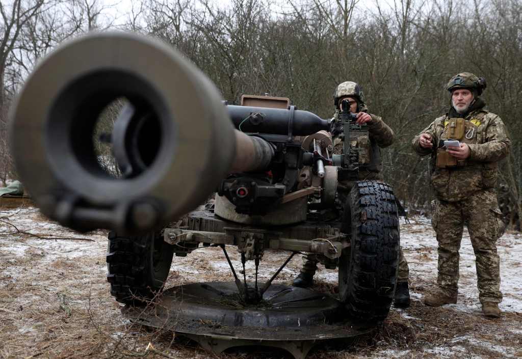 Ukrainian artillerymen prepare to fire an L119 howitzer towards Russian positions at a front line in the Lugansk region on Jan. 16, 2023.