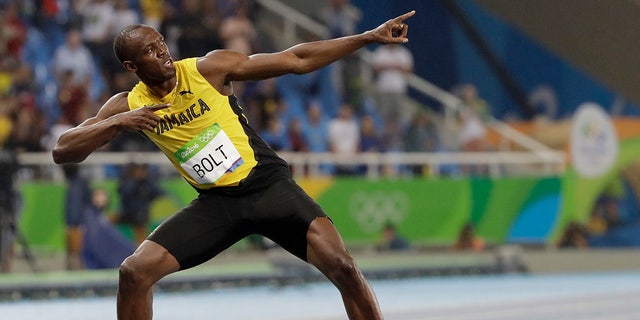 Usain Bolt from Jamaica celebrates winning the gold medal in the men's 200-meter final during the 2016 Summer Olympics in Rio de Janeiro, Brazil.