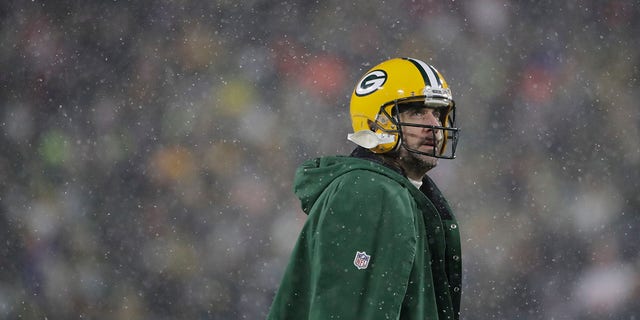 The Green Bay Packers' Aaron Rodgers looks up during the second half of an NFC divisional playoff game against the San Francisco 49ers Jan. 22, 2022, in Green Bay, Wis.