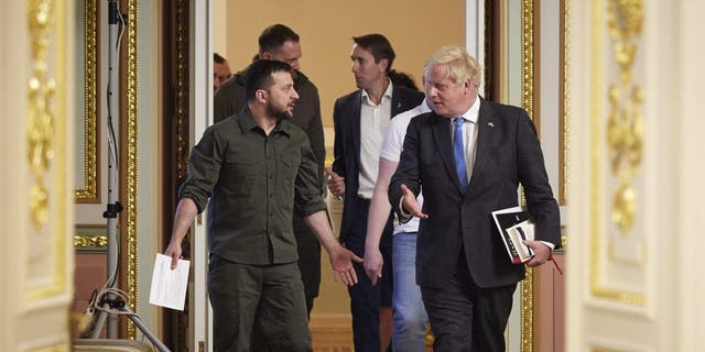 In this image provided by the Ukrainian Presidential Press Office, Ukrainian President Volodymyr Zelenskyy, left, and Britain's Prime Minister Boris Johnson, walk after their meeting in Kyiv, Ukraine, Friday, June 17, 2022. 