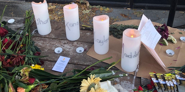 Candles and flowers are left at a make-shift memorial honoring four slain University of Idaho students outside the Mad Greek restaurant in downtown Moscow, Idaho, on Tuesday, Nov. 15, 2022. Police discovered the bodies of the four students at home near campus on Sunday, Nov. 13, 2022, and said the killer or killers used a knife or bladed weapon in the targeted attack. Two of the victims, 21-year-old Madison Mogen and 20-year-old Xana Kernodle, were servers at Mad Greek. 