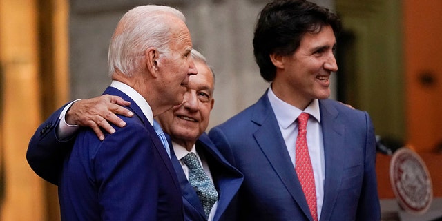 President Joe Biden, Mexican President Andres Manuel Lopez Obrador, and Canadian Prime Minister Justin Trudeau embrace during a news conference at the 10th North American Leaders' Summit at the National Palace in Mexico City, Tuesday, Jan. 10, 2023. 